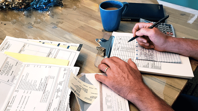 Man-Managing-Bills-Paperwork